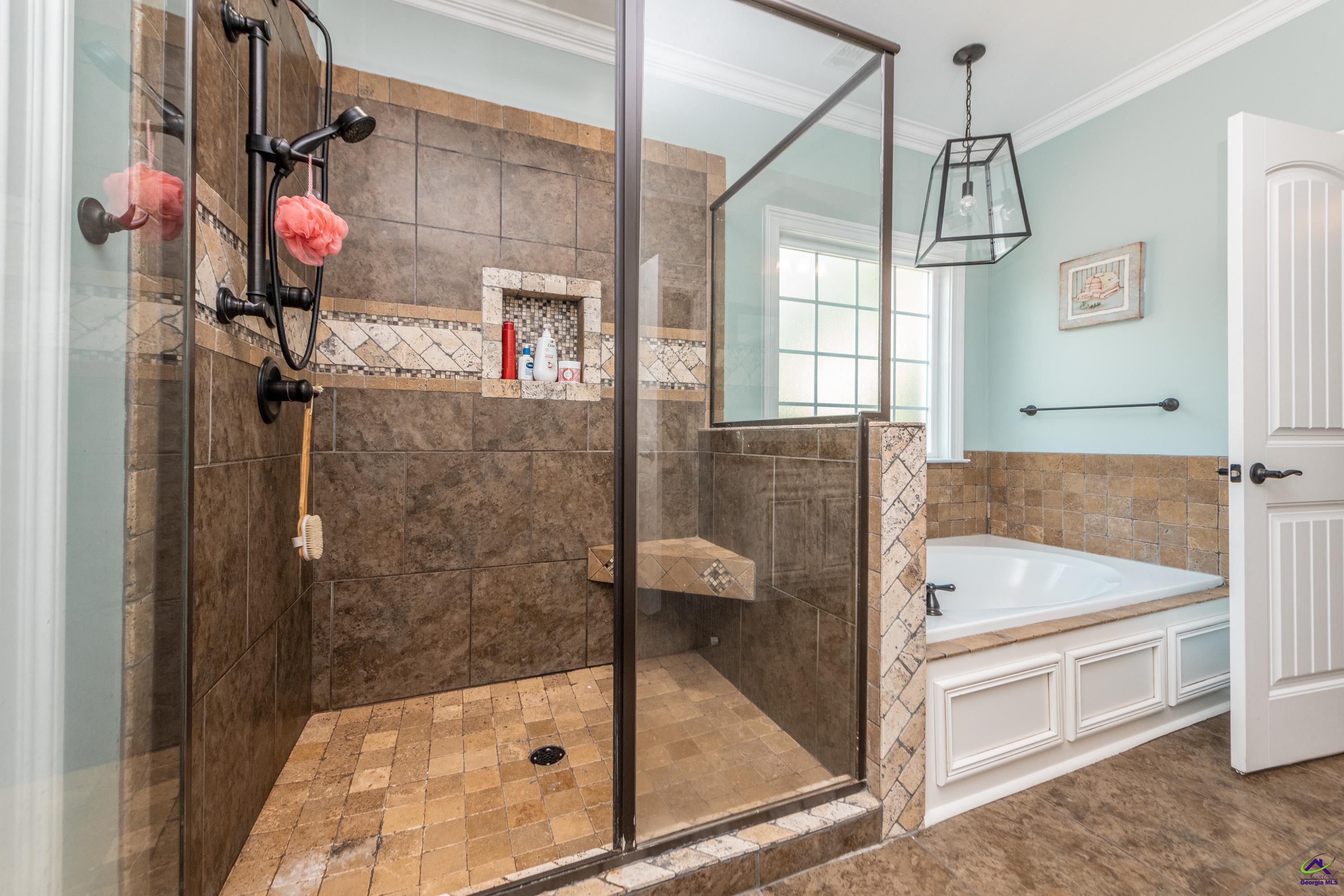 405 Old Bridge Road Warner Robins, GA 31088 - Photo 25 of 58 a bathroom with a bathtub and shower