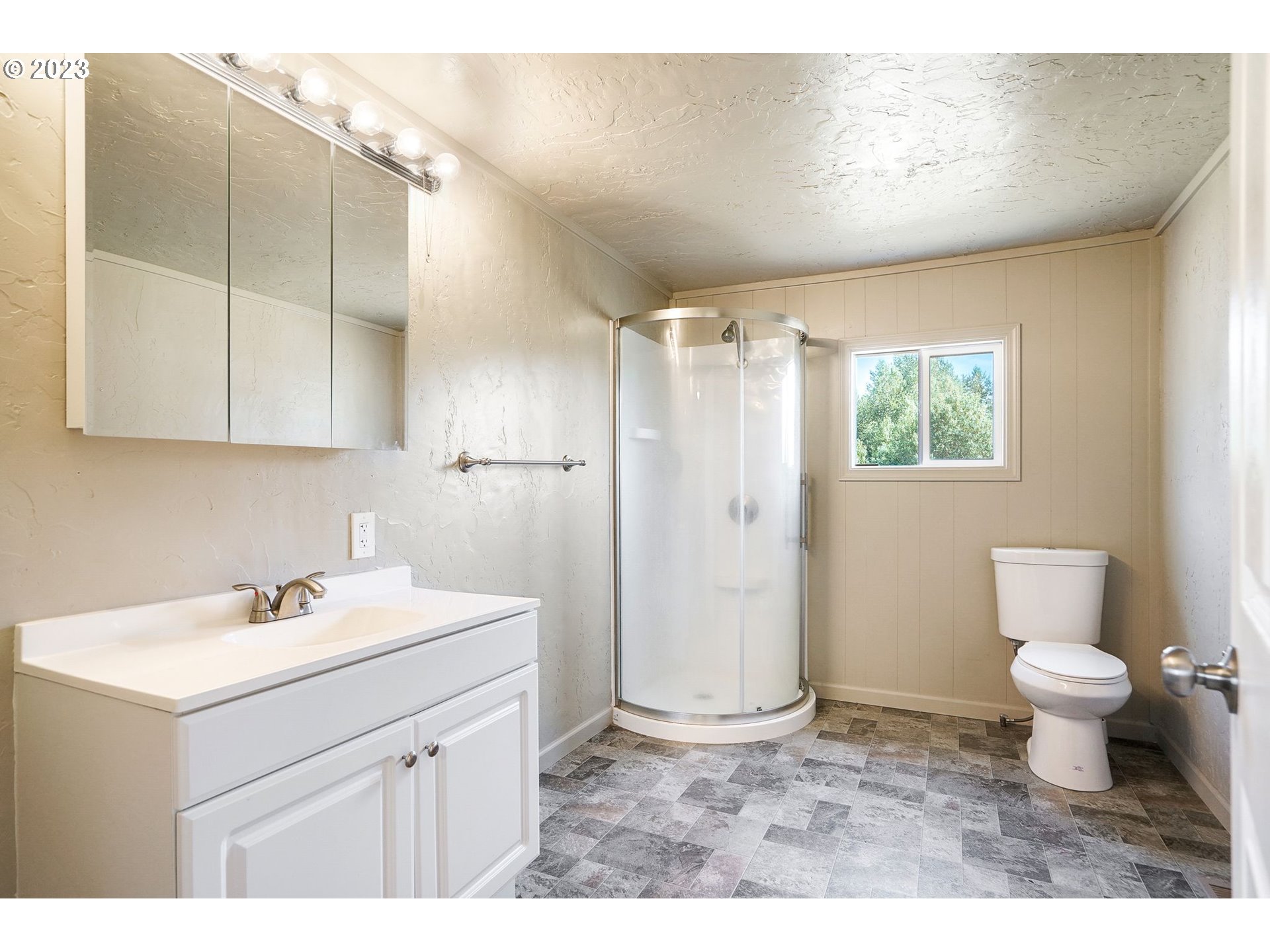 34075 Mt Pleasant Road Lebanon, OR 97355 - Photo 21 of 39 a bathroom with a sink toilet a mirror and shower