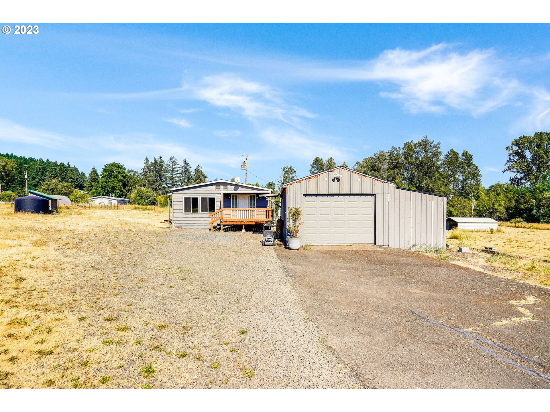 34075 Mt Pleasant Road Lebanon, OR 97355 - Photo 3 of 39 a picture of a field and a building in the background