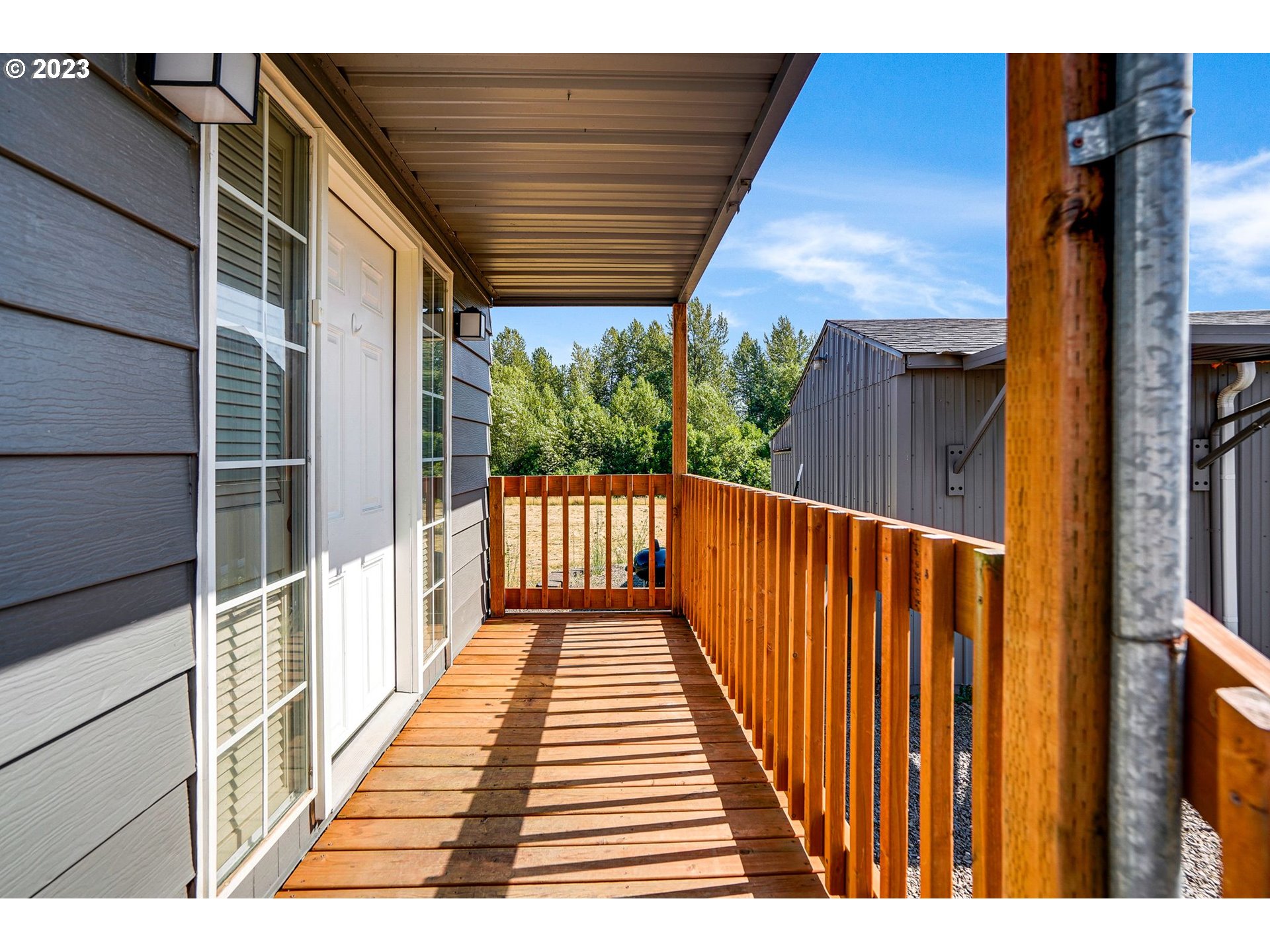 34075 Mt Pleasant Road Lebanon, OR 97355 - Photo 5 of 39 a view of a balcony with wooden floor