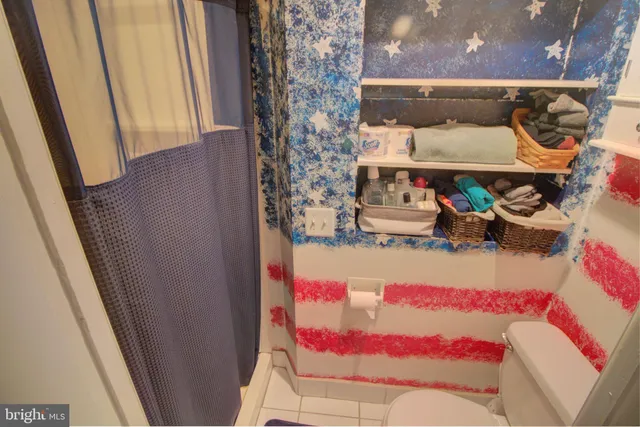 a view of a balcony with chairs and a fire pit