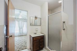 1717 Pipeline Road Cleburne, TX 76033 - Photo 12 of 33 Bathroom featuring vanity and a shower stall