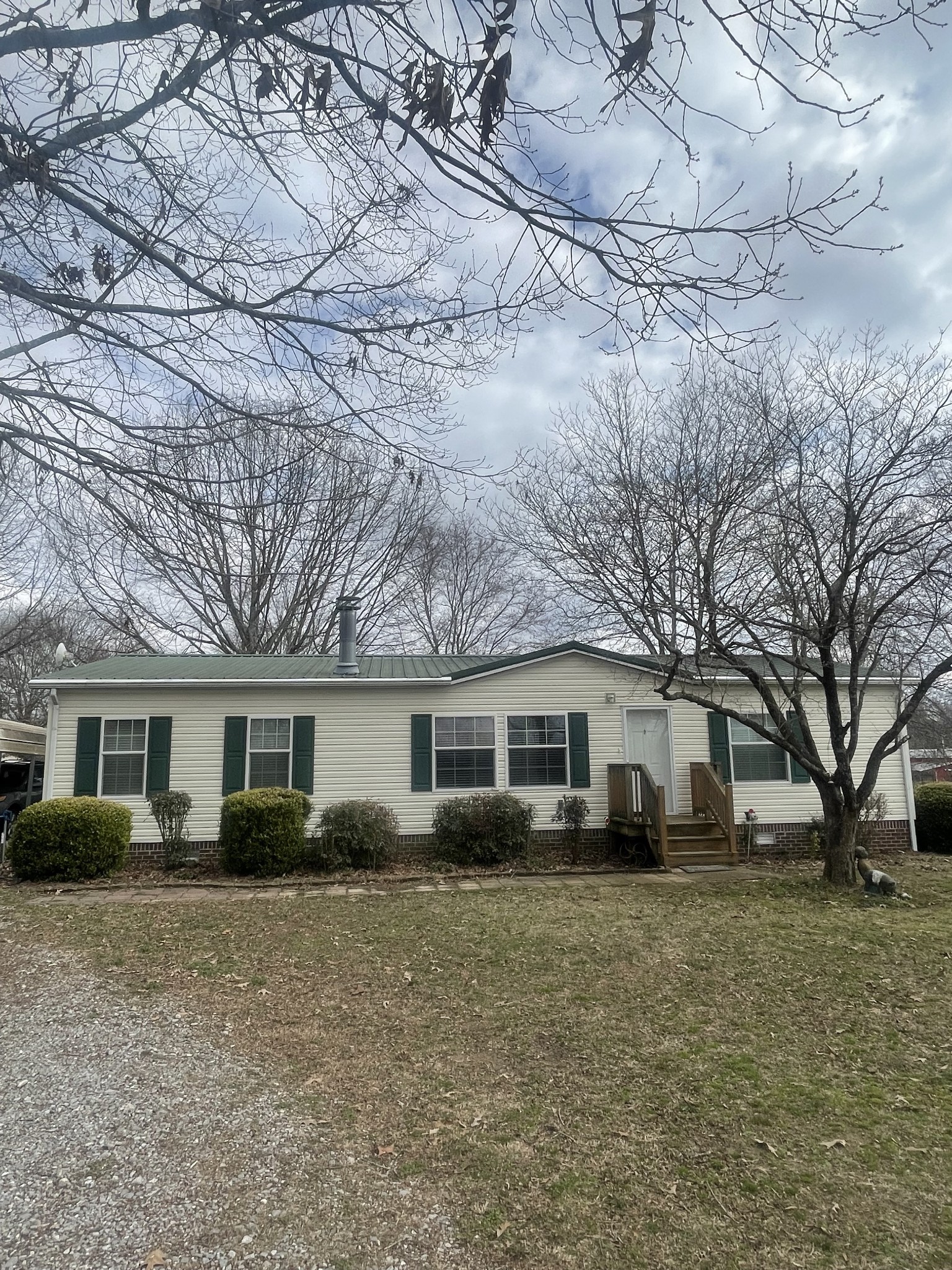 75 Snell Road Ethridge, TN 38456 - Photo 50 of 51 a front view of house with a garden