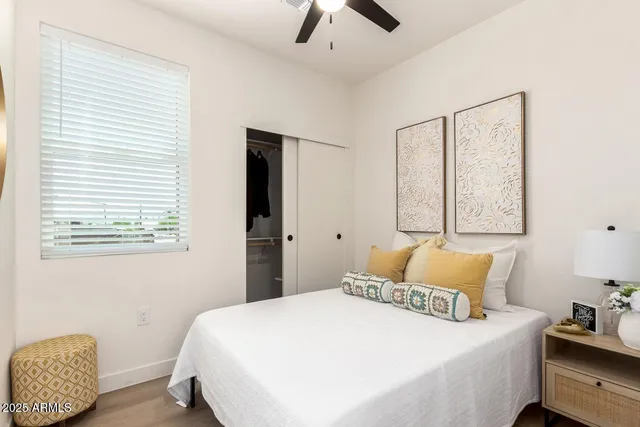 a bedroom with a bed and window