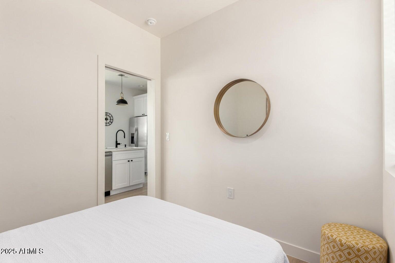 1508 West Sherman Street, Unit B Phoenix, AZ 85007 - Photo 12 of 16 a bathroom with a granite countertop sink and a mirror