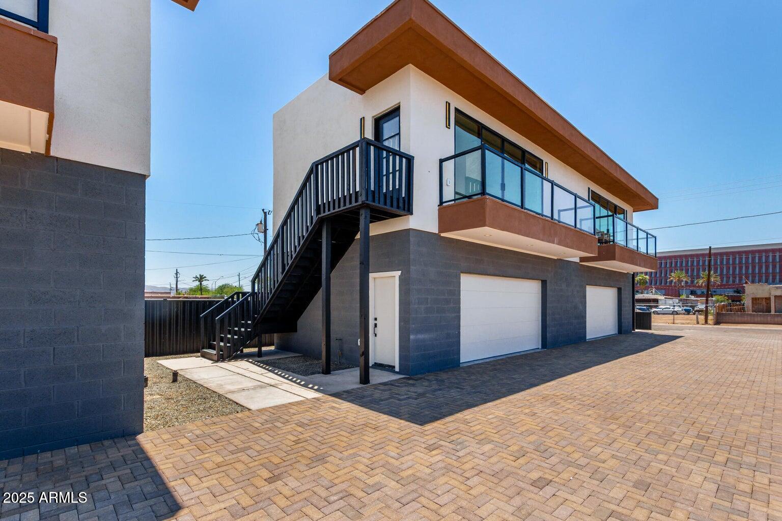 1508 West Sherman Street, Unit B Phoenix, AZ 85007 - Photo 16 of 16 a front view of a house with a yard