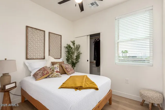 a bedroom with a bed and a chair