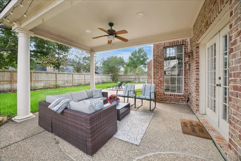 a balcony with furniture and a garden