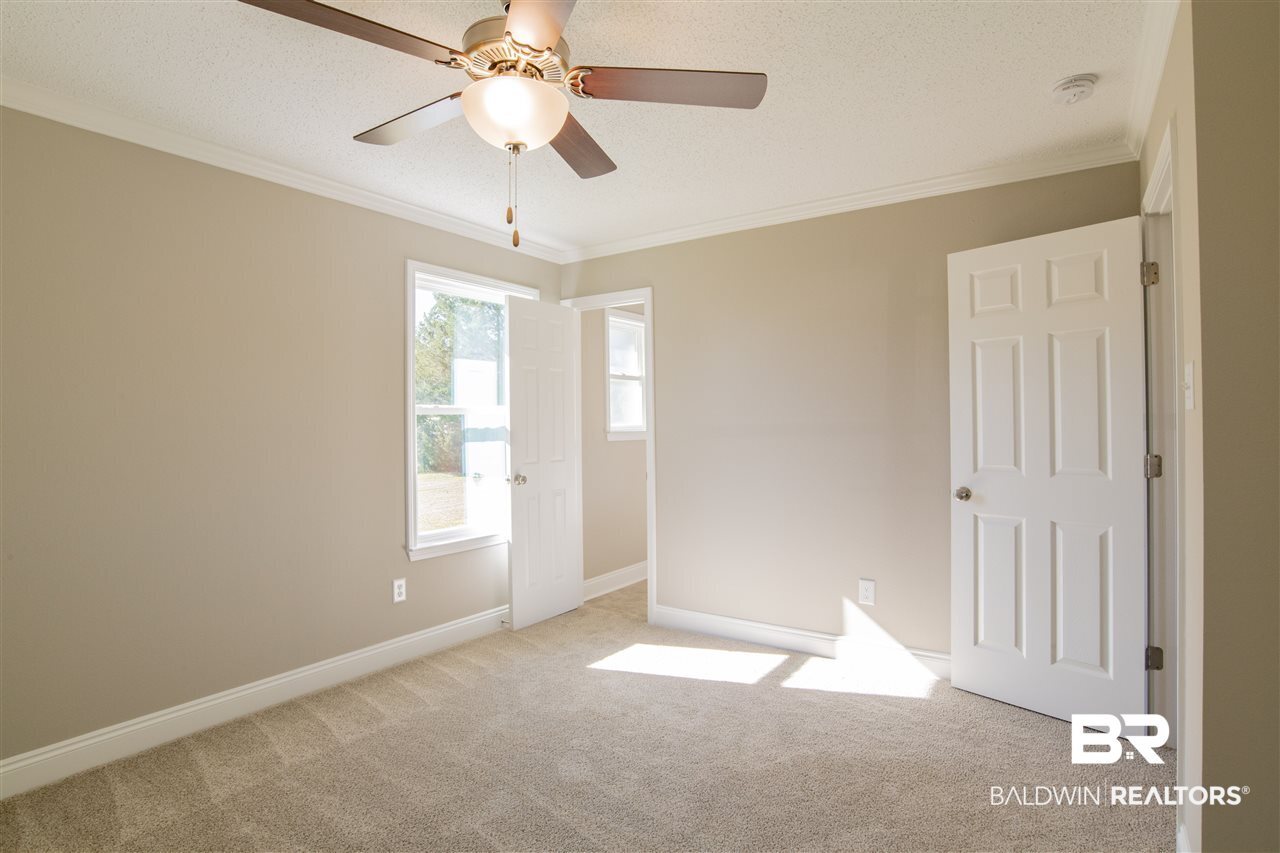 9141 Semmes Court Semmes, AL 36575 - Photo 13 of 28 Master bedroom retreat.