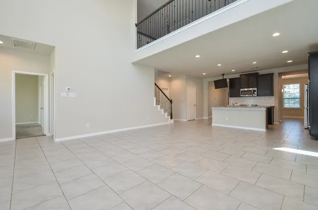a view of a kitchen with a sink and an oven
