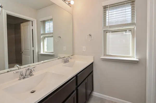 a bathroom with a sink a vanity and a mirror