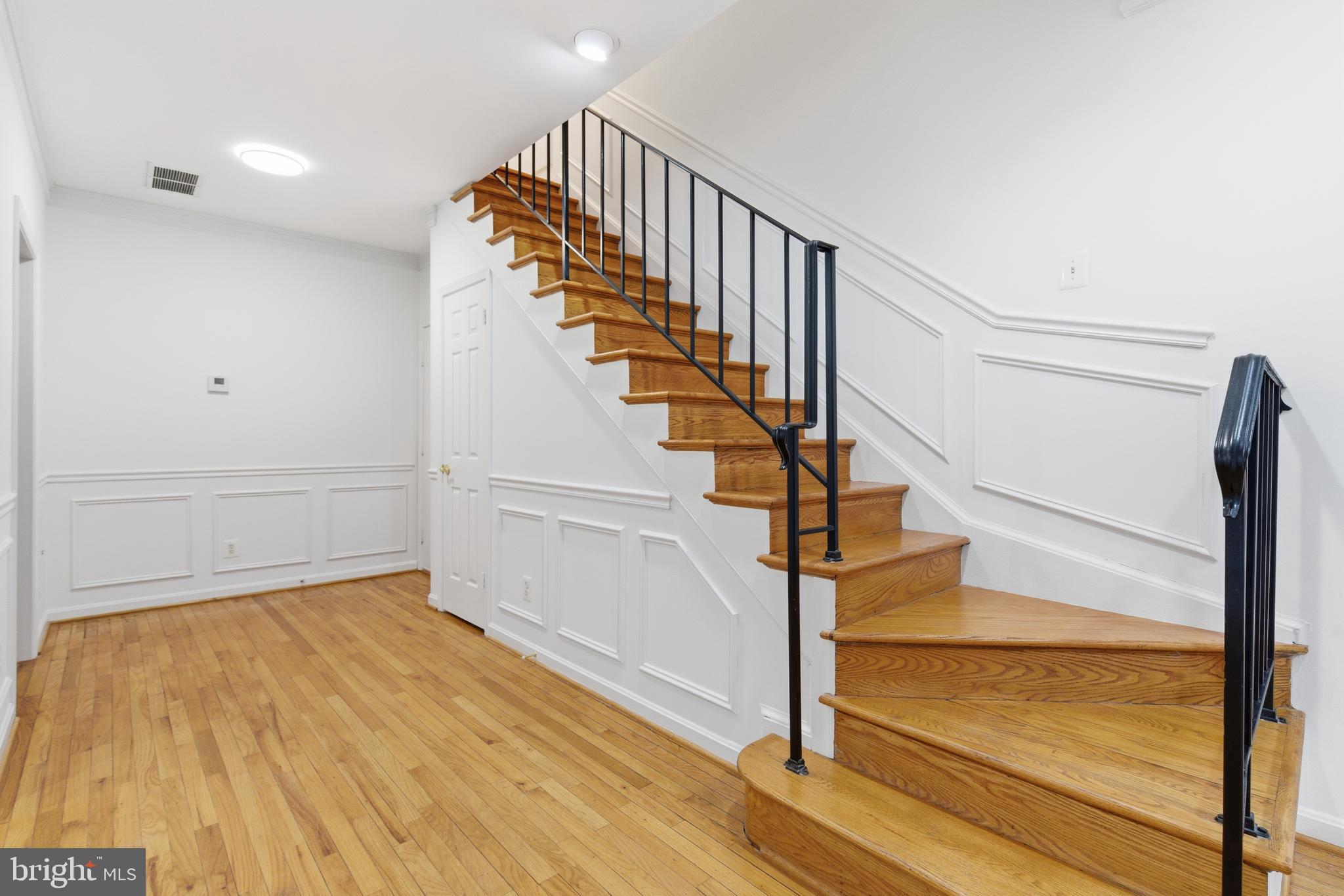 1203 N Street Northwest, Unit E Washington, DC 20005 - Photo 11 of 24 a view of entryway and hall with wooden floor