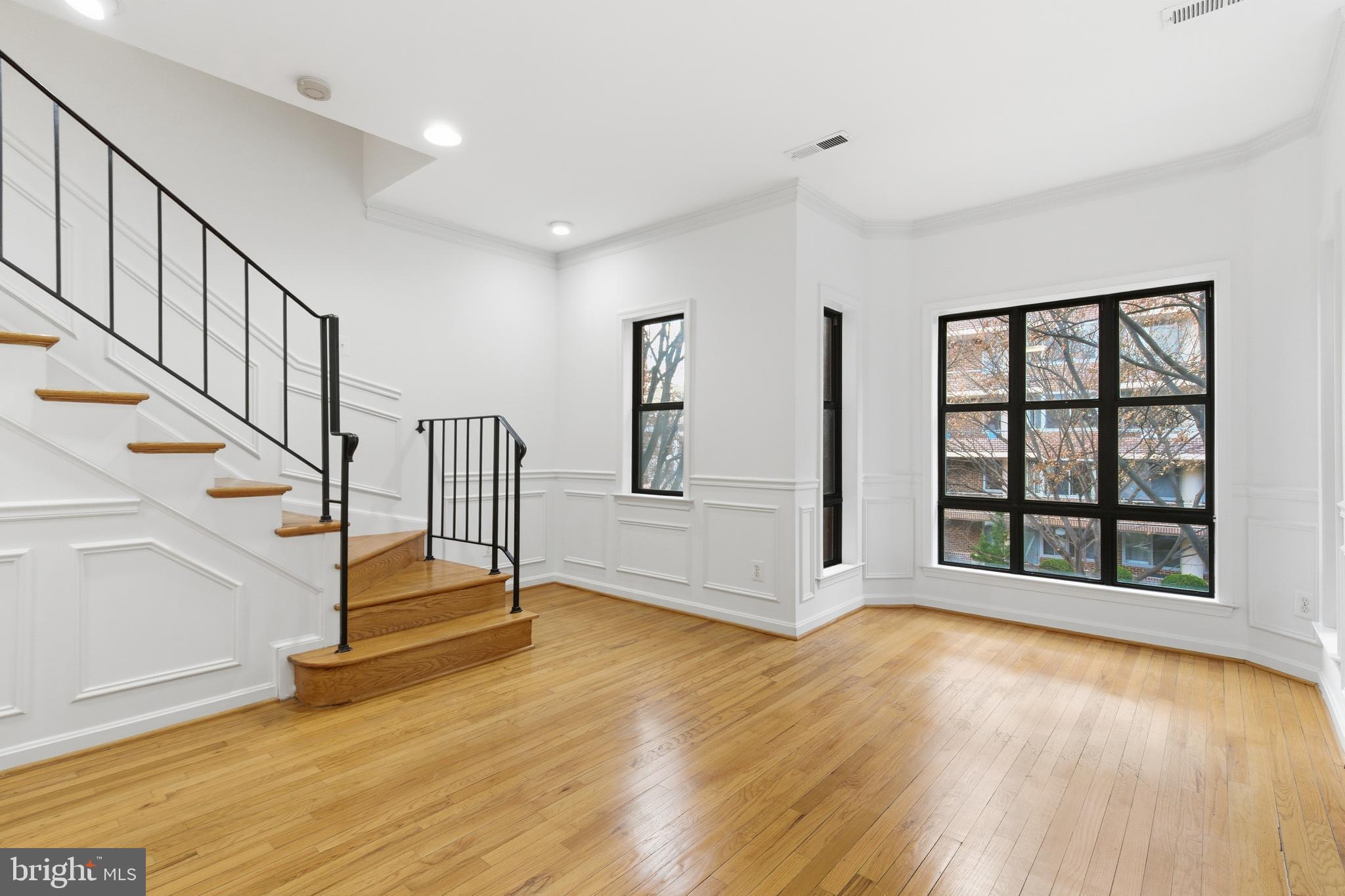 1203 N Street Northwest, Unit E Washington, DC 20005 - Photo 12 of 24 a view of entryway with wooden floor and front door