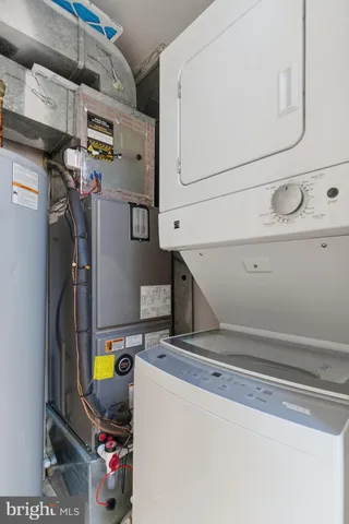 a view of storage and utility room with washer and dryer