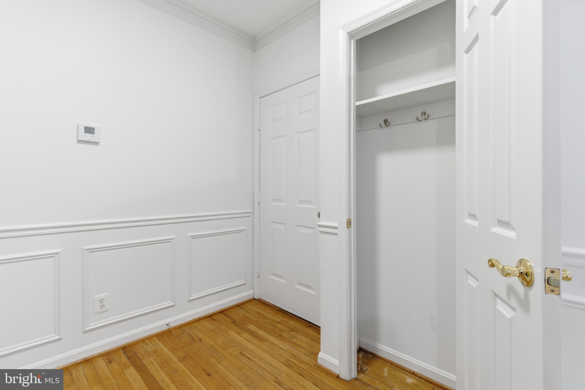 1203 N Street Northwest, Unit E Washington, DC 20005 - Photo 10 of 24 a view of an empty room with wooden floor