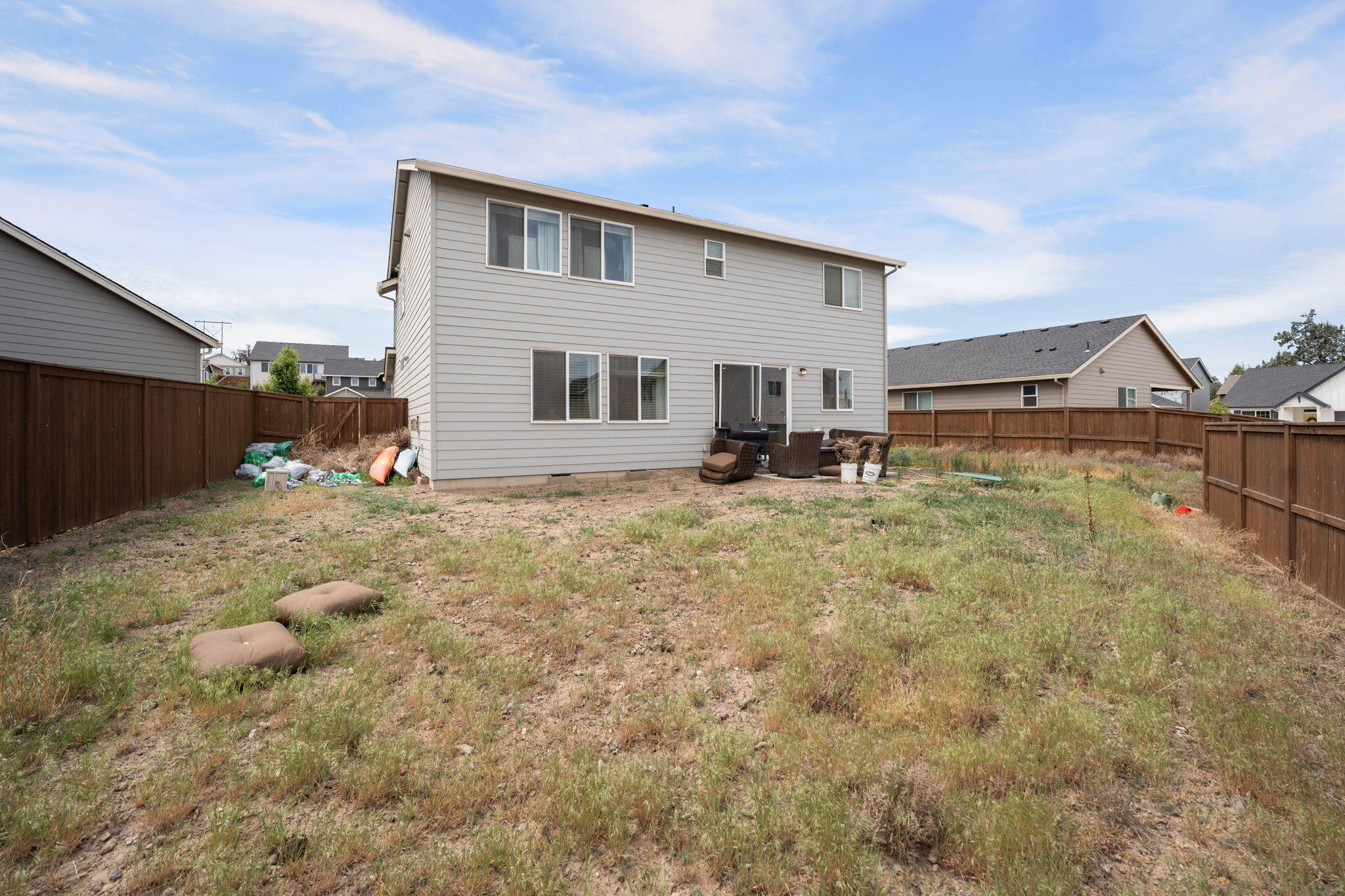 4039 Southwest Quartz Place Redmond, OR 97756 - Photo 43 of 44 a backyard of a house with table and chairs
