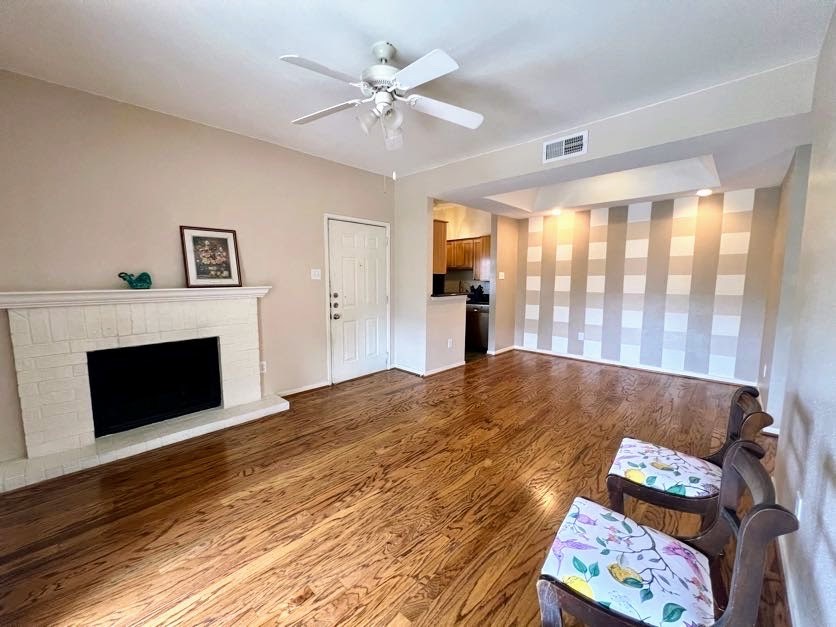4041 Drake Street, Unit 118 Houston, TX 77005 - Photo 4 of 22 a bed room with a bed and a fireplace