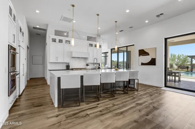 a large kitchen with lots of counter space and refrigerator