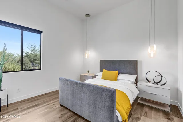 a bedroom with a bed and window