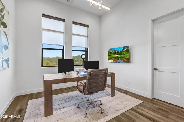 a workspace with furniture and window