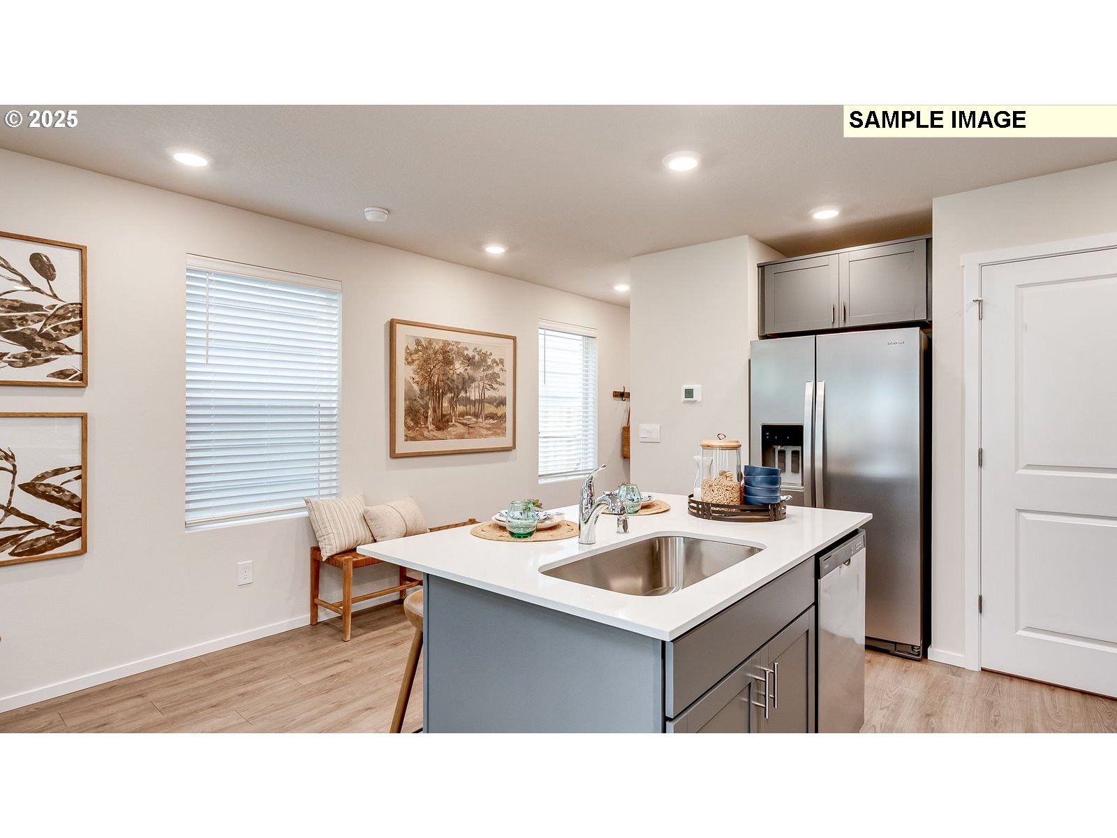 1101 Southeast 194th Place Camas, WA 98607 - Photo 6 of 28 a kitchen with a sink refrigerator and dining table