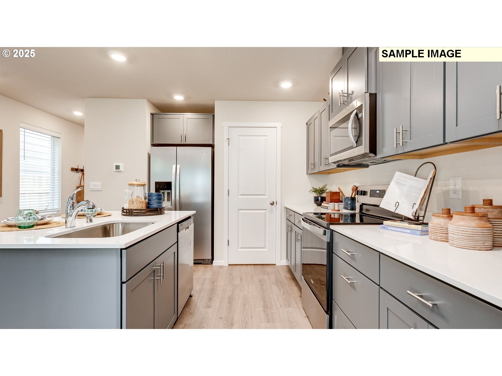 1101 Southeast 194th Place Camas, WA 98607 - Photo 7 of 28 a kitchen with a sink stainless steel appliances and cabinets