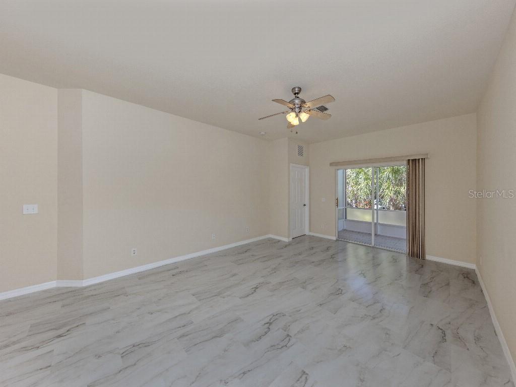 11649 Tempest Harbor Loop Venice, FL 34292 - Photo 11 of 39 a view of an empty room with a window