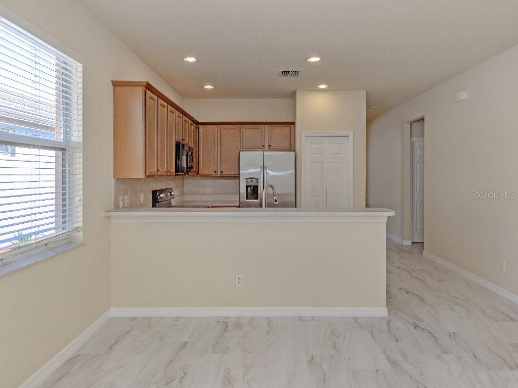 11649 Tempest Harbor Loop Venice, FL 34292 - Photo 8 of 39 a view of kitchen with wooden floor