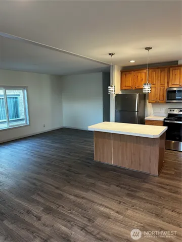 a view of kitchen with wooden floor