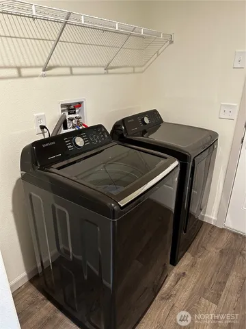 a kitchen with a refrigerator and a stove
