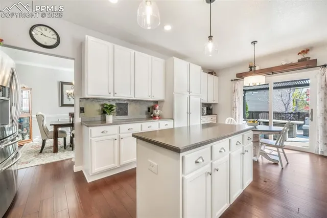a kitchen with lots of counter top space and dining table