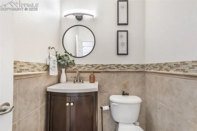 a view of a hallway with wooden floor and windows