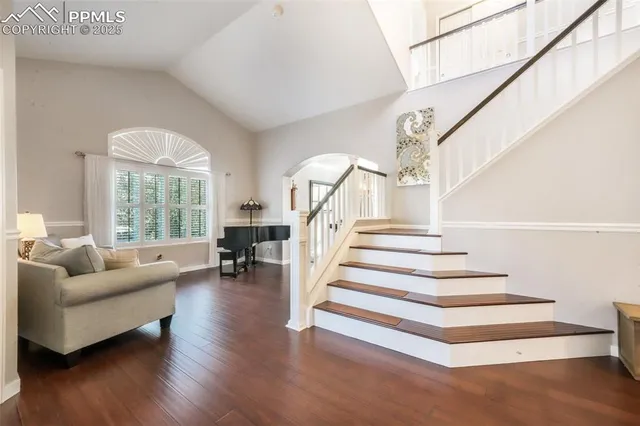 a room with furniture pool table and windows
