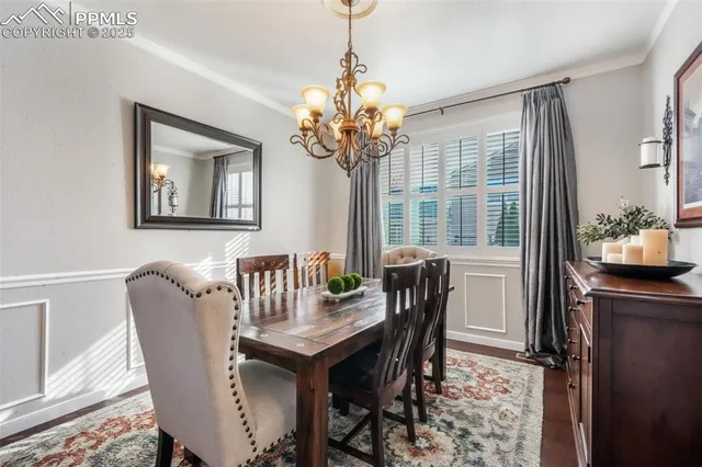 a kitchen with stainless steel appliances granite countertop a lot of counter space and wooden floors