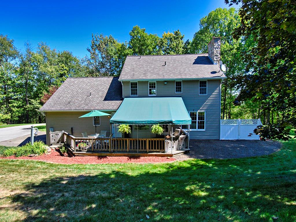 1671 Coulter Road Apollo, PA 15613 - Photo 5 of 25 Rear Exterior: A large partially covered deck is right off of the kitchen and with two easy access doors. One to the kitchen/living room, and the other to a hallway w/closet and the main floor half bath.