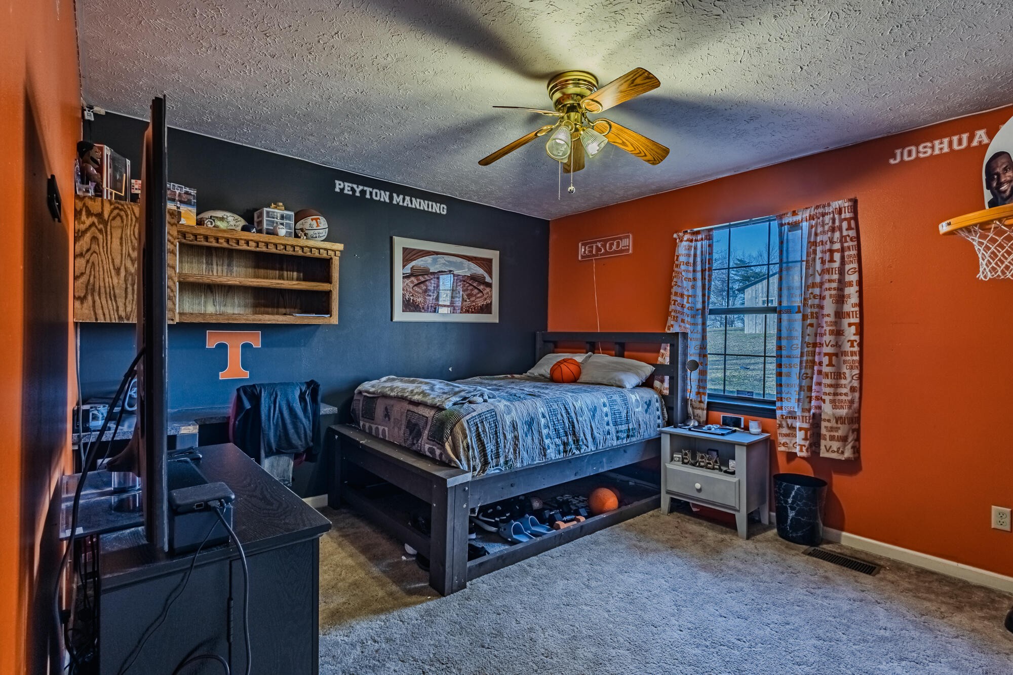 947 Butler Road Niota, TN 37826 - Photo 19 of 43 a bedroom with a bed and a chandelier