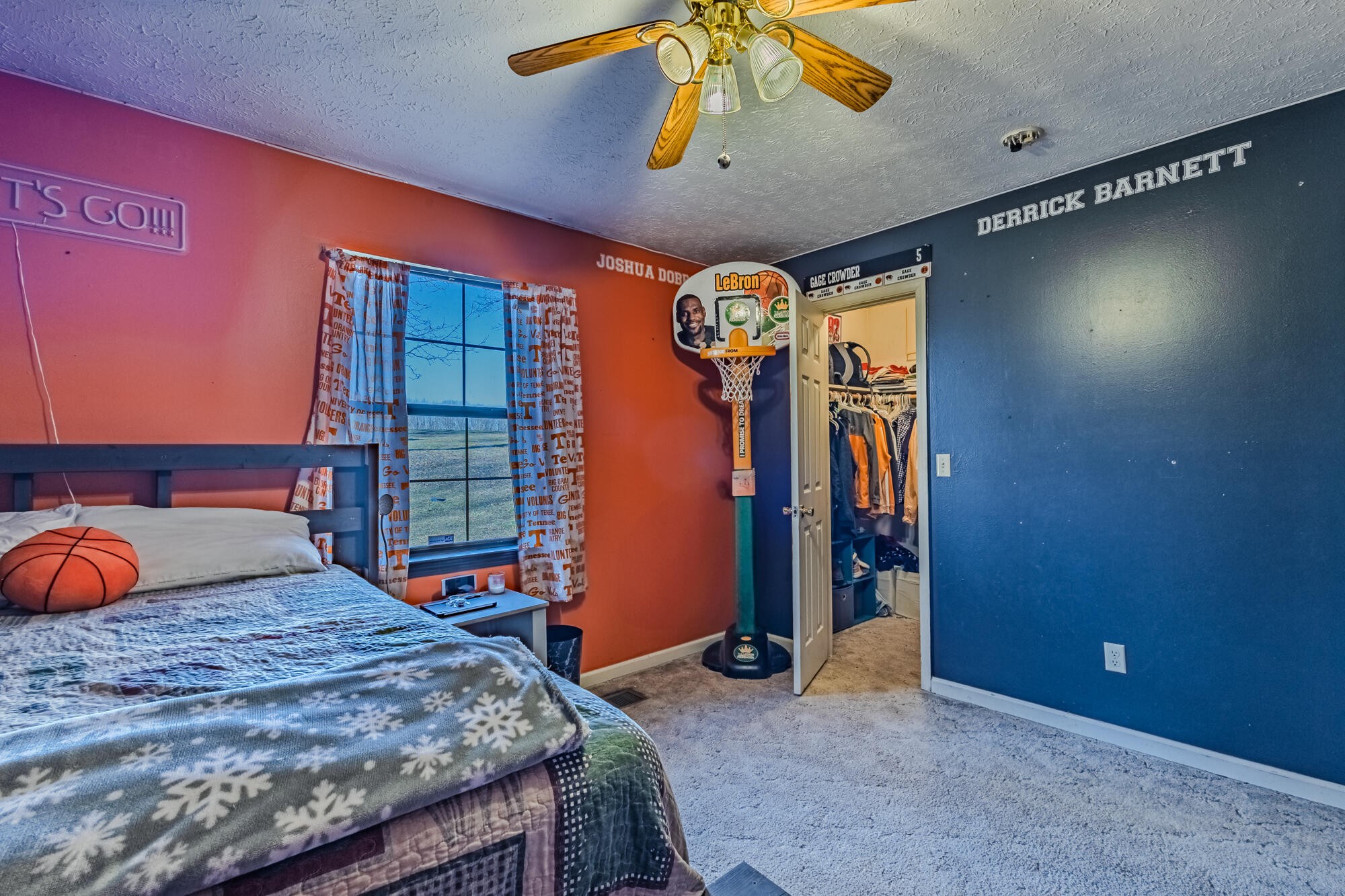 947 Butler Road Niota, TN 37826 - Photo 20 of 43 a bedroom with a bed and a chandelier