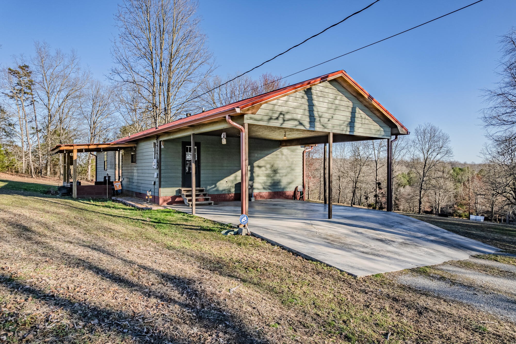 947 Butler Road Niota, TN 37826 - Photo 32 of 43 a view of a house with a yard balcony and large tree