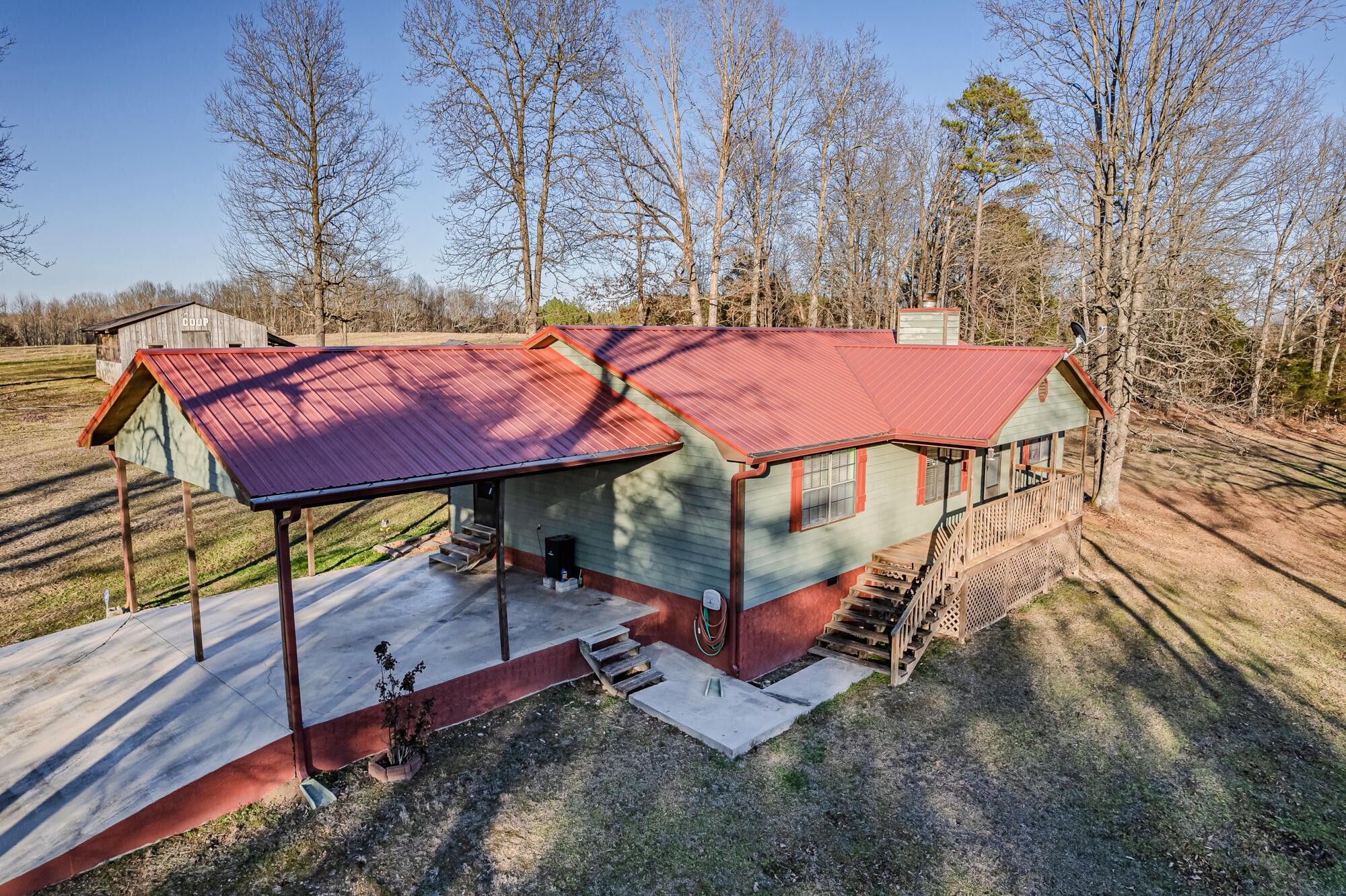 947 Butler Road Niota, TN 37826 - Photo 4 of 43 a view of a patio with a table chairs and a fire pit