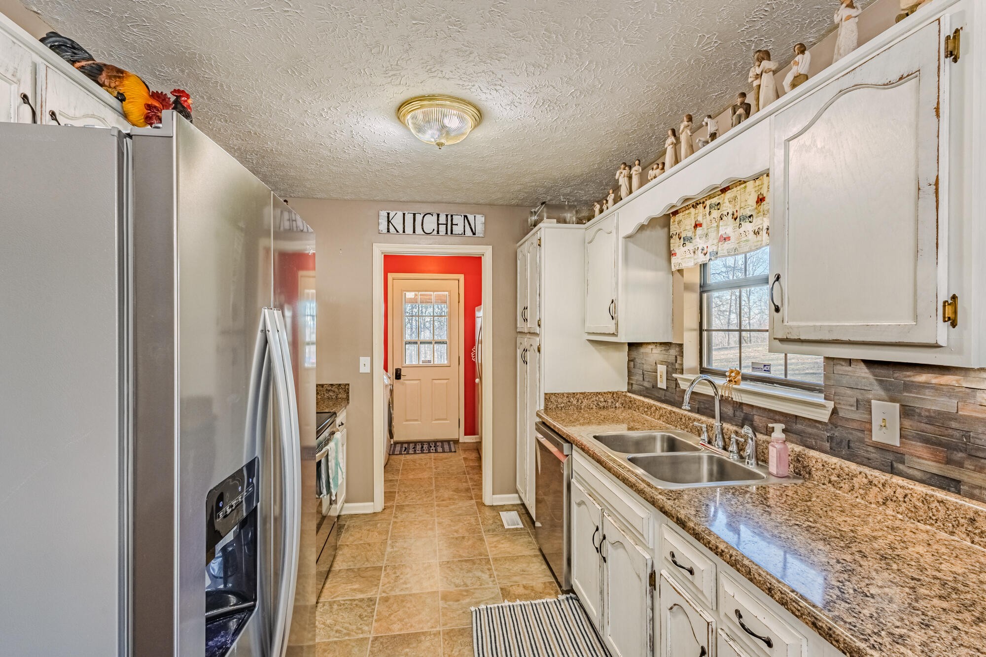 947 Butler Road Niota, TN 37826 - Photo 8 of 43 a kitchen with a sink stove and refrigerator
