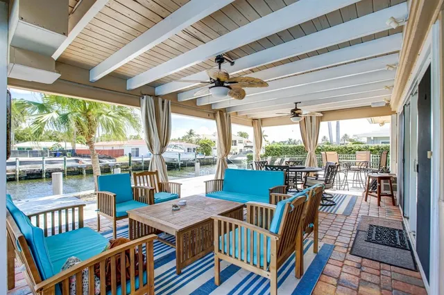 a dining room with furniture water view and a ocean view