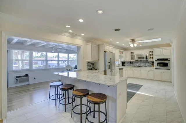 a kitchen with a table and chairs in it
