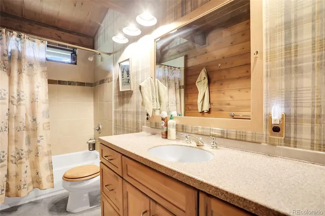 a bathroom with a sink vanity and a mirror