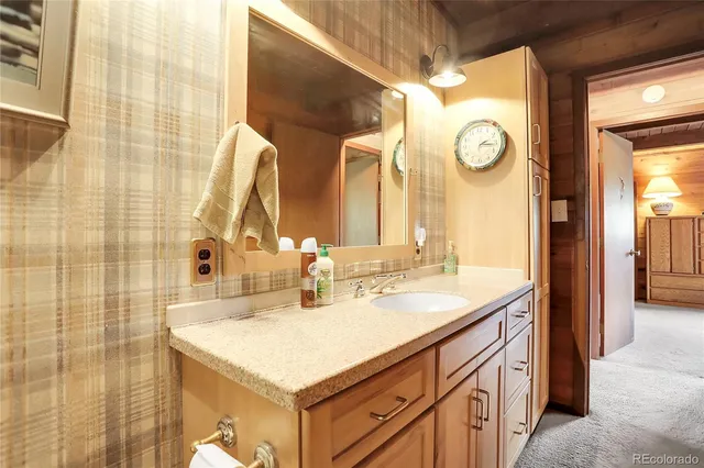 a bathroom with a white toilet and a shower curtain