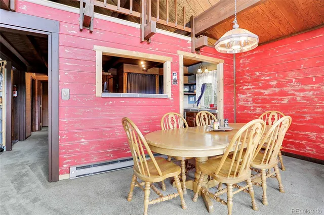 a view of a balcony with two chairs and a table