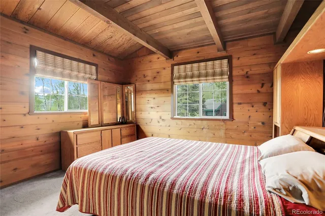 a view of a backyard with sitting area