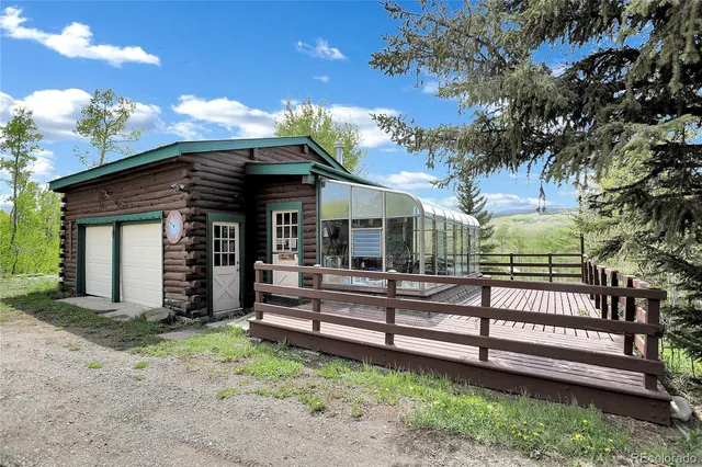 a room with lots of trees and furniture