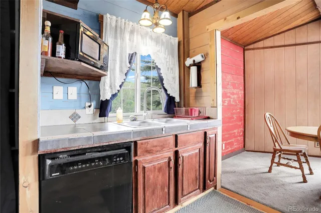 a kitchen with stainless steel appliances granite countertop a stove and a sink
