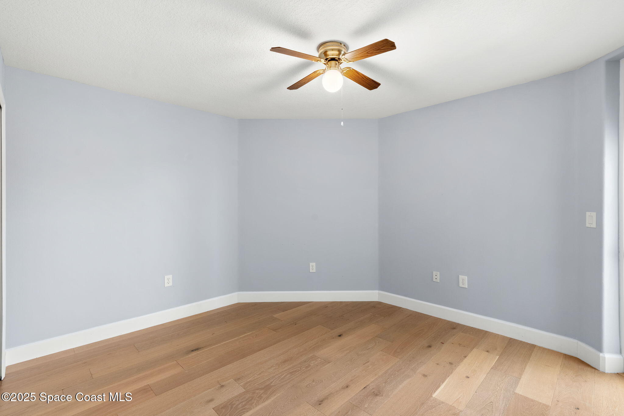 800 Del Rio Way, Unit 401 Merritt Island, FL 32953 - Photo 19 of 36 wooden floor in an empty room
