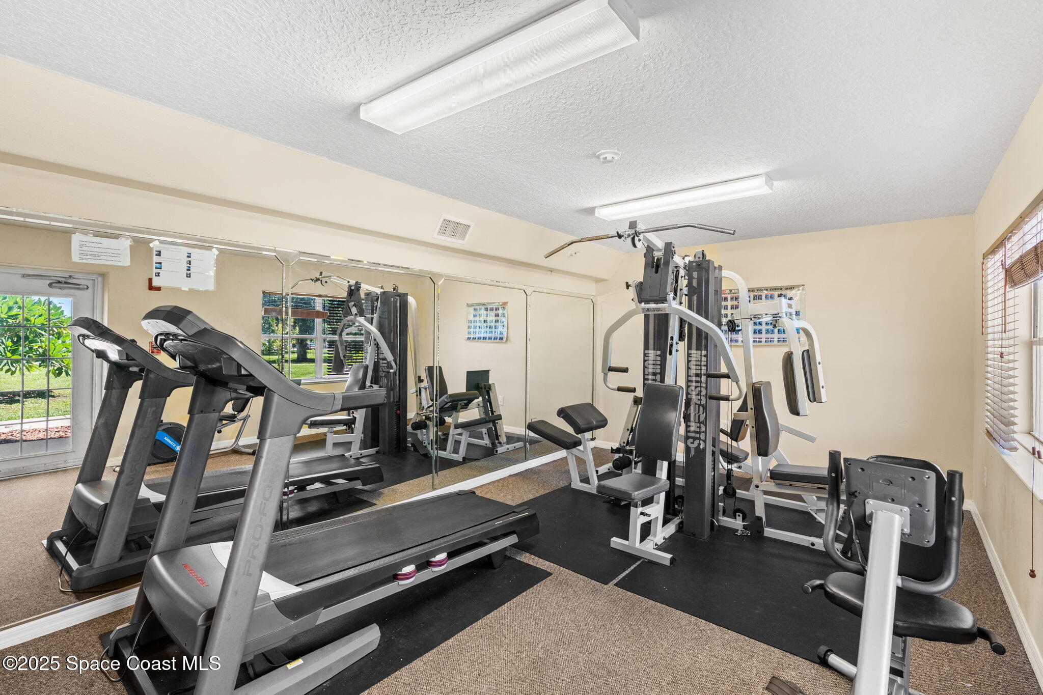 800 Del Rio Way, Unit 401 Merritt Island, FL 32953 - Photo 28 of 36 a view of a room with gym equipment